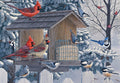 Vibrant red cardinals, blue jays, nuthatches, and chickadees gather at a snowy wooden bird feeder amidst frosted evergreen trees and a white picket fence, capturing a serene winter wildlife scene.