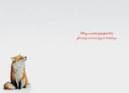 Inside of a heartwarming winter fox greeting card, featuring a smaller image of the same cute fox sitting in snow on the bottom left. The card's interior is clean white with the festive message 'May a world of perfect bliss fill every moment of your holidays.' printed in red script, ready for a personal touch.