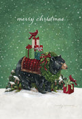 Front of a festive greeting card featuring a majestic black bear adorned with a green wreath and red tartan saddle blanket, carrying a stack of beautifully wrapped holiday presents. A bright red cardinal perches on the gifts, with falling snow against a vibrant green background, conveying a warm winter wonderland scene. The words 'merry christmas' are subtly displayed at the top.