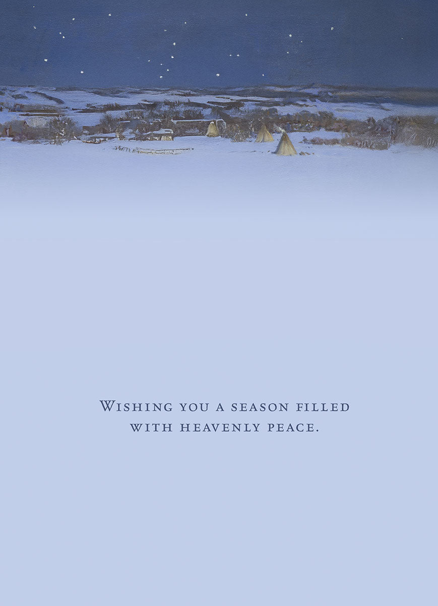 Interior of a religious holiday greeting card showing a peaceful, snowy winter landscape with distant tipis under a starry night sky, with the message 'WISHING YOU A SEASON FILLED WITH HEAVENLY PEACE.'.