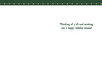 Inside view of a Howdy Doo Season greeting card with a simple white background and a green starry border at the top. The message reads 'Thinking of y'all and wishing you a happy holiday season!'