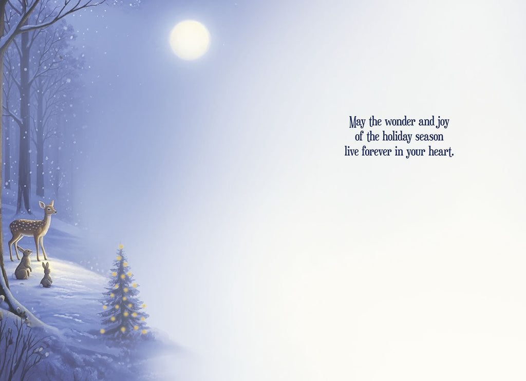 Inside of a heartwarming festive card, displaying a winter wonderland scene with a small decorated tree, deer, and rabbit on a snowy hill, alongside the message 'May the wonder and joy of the holiday season live forever in your heart.'.