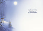 Inside of a heartwarming festive card, displaying a winter wonderland scene with a small decorated tree, deer, and rabbit on a snowy hill, alongside the message 'May the wonder and joy of the holiday season live forever in your heart.'.
