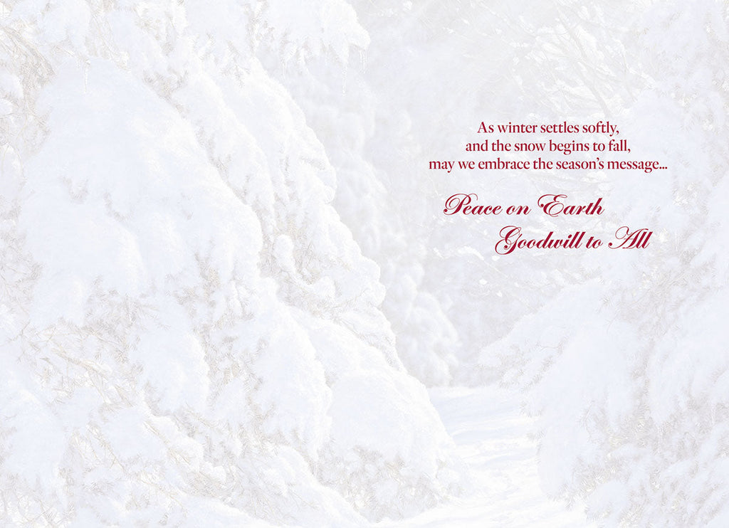 Inside of a greeting card with a delicate snowy background and elegant red script text reading 'Peace on Earth Goodwill to All' for the holiday season.