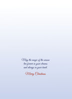 Interior of a heartfelt holiday card with elegant script wishing 'May the magic of the season live forever in your dreams and always in your heart. Merry Christmas.'