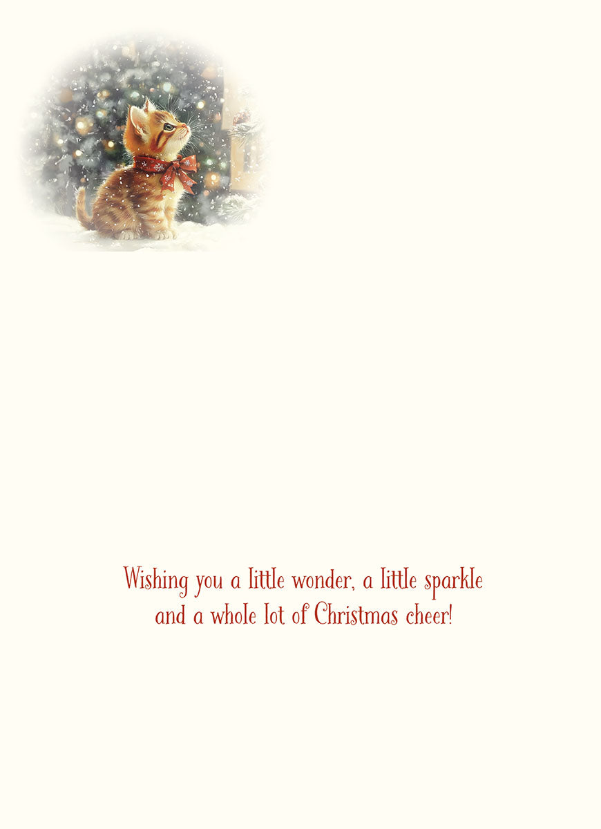 Inside of holiday greeting card featuring a small image of an orange kitten with a red bow, with the printed message 'Wishing you a little wonder, a little sparkle and a whole lot of Christmas cheer!' in elegant red script.