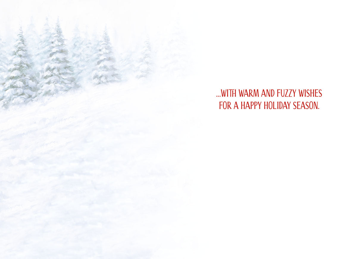 Inside of a holiday greeting card featuring a soft focus snowy landscape with evergreen trees. Red text reads: '...WITH WARM AND FUZZY WISHES FOR A HAPPY HOLIDAY SEASON.'