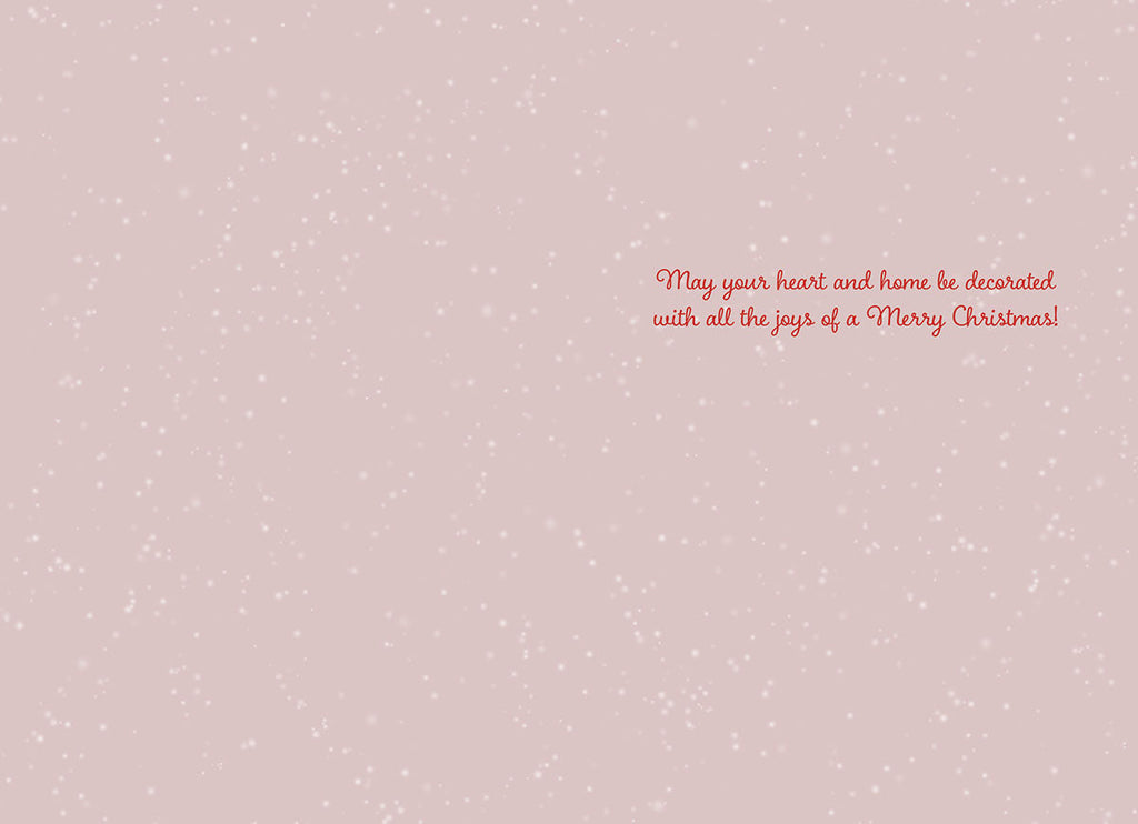 Interior of a heartfelt holiday greeting card featuring a light pink speckled background and elegant red script message for a joyous celebration.