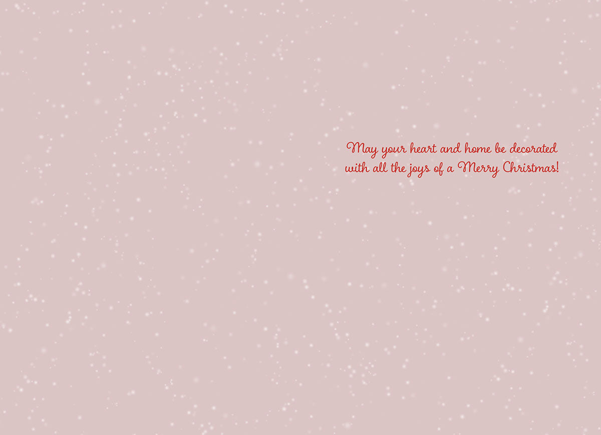 Interior of a heartfelt holiday greeting card featuring a light pink speckled background and elegant red script message for a joyous celebration.