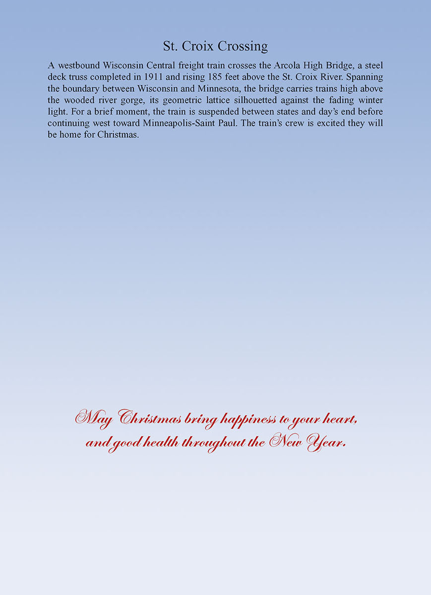 Inside of a greeting card with elegant red script text reading 'May Christmas bring happiness to your heart, and good health throughout the New Year.' against a soft blue gradient background.