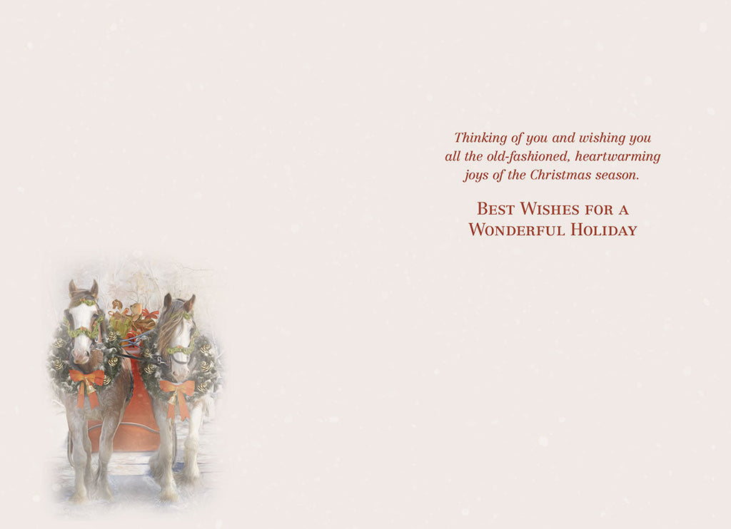 Inside view of the holiday greeting card, showing a smaller depiction of the horse-drawn sleigh on the left and a heartfelt printed message on the right: 'Thinking of you and wishing you all the old-fashioned, heartwarming joys of the Christmas season. BEST WISHES FOR A WONDERFUL HOLIDAY'.