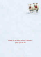 Inside view of a peaceful winter greeting card with two sheep and the message 'Wishing you the timeless treasures of Christmas—peace, hope, and love' on a serene light blue background.
