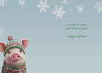 Inside of a holiday greeting card featuring a cute pig in a winter hat. Text reads '...enough to warm your heart all year! Happy Holidays' on a snowy blue background, for warm wishes.