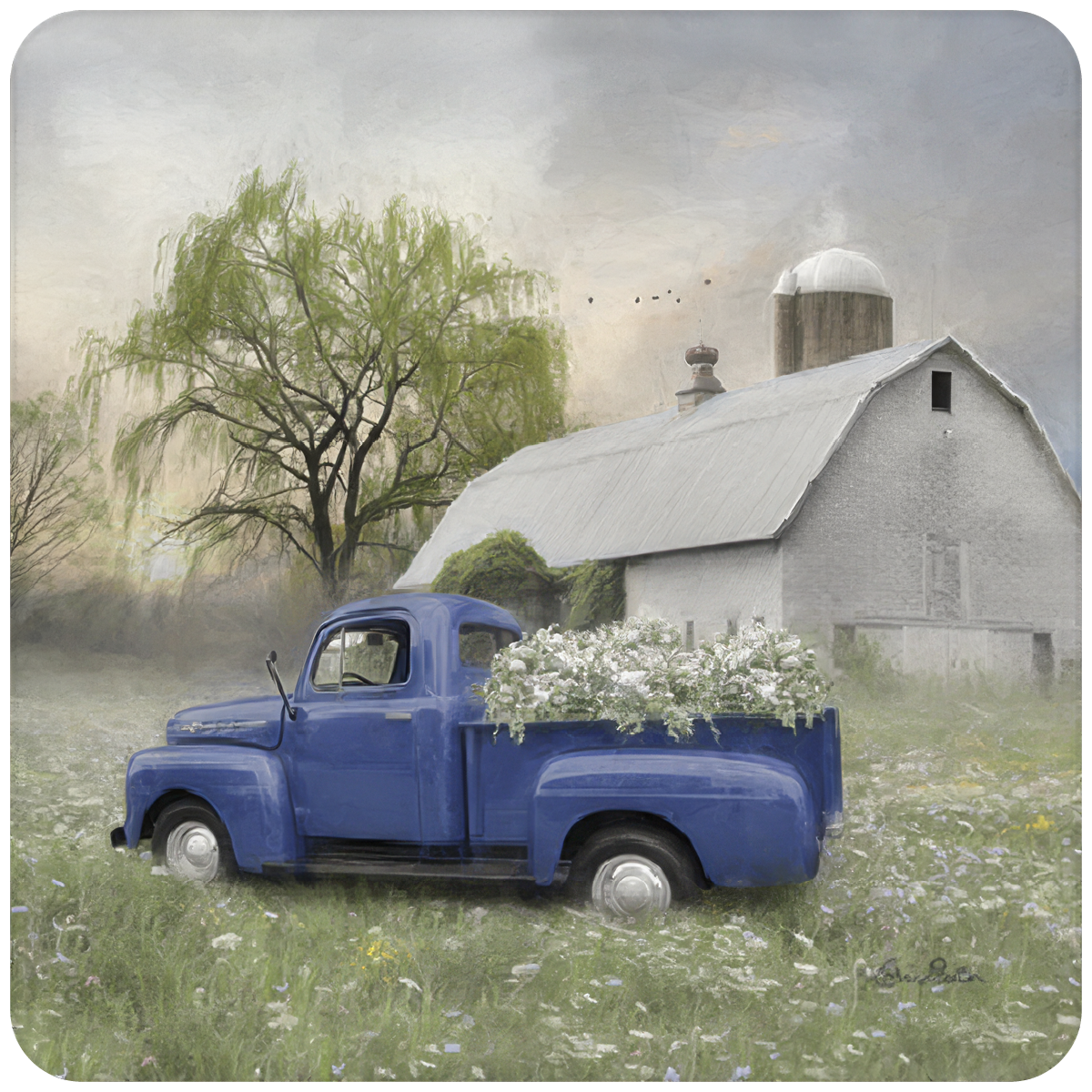 A vintage blue pickup truck filled with white flowers, parked in a lush green field of wildflowers. In the background, a rustic gray barn and silo stand under a soft, cloudy sky, with a weeping willow tree to the left. The scene evokes a peaceful, serene farmhouse aesthetic.