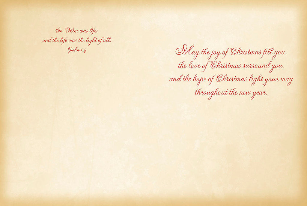 Inside of religious greeting card with scripture 'John 1:4' and a message 'May the joy of Christmas fill you...' on a vintage parchment background.