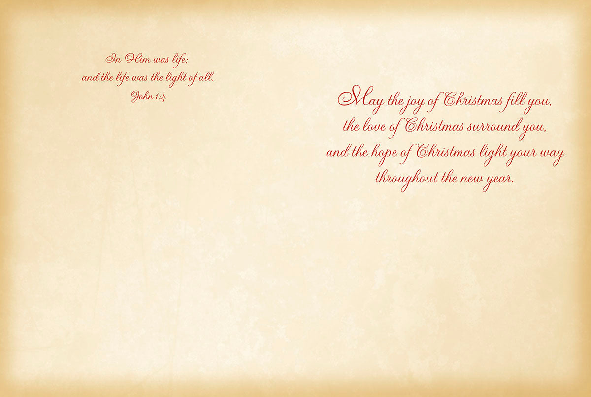 Inside of religious greeting card with scripture 'John 1:4' and a message 'May the joy of Christmas fill you...' on a vintage parchment background.