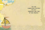 Inside view of an inspirational greeting card with a small sailboat illustration. Text reads: 'YOU ARE SURROUNDED AND HELD BY LOVE THROUGH EVERY PART OF THIS JOURNEY.' Ideal for sending heartfelt support.
