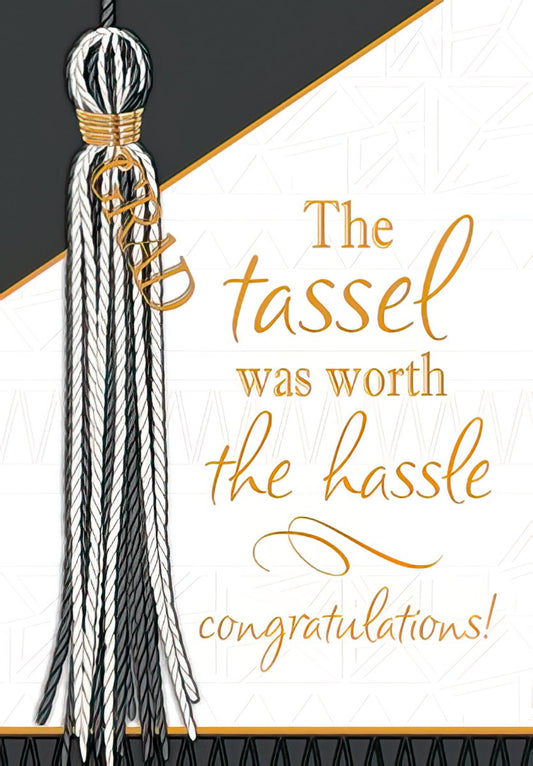 Front of a modern graduation greeting card featuring a black and white tassel with gold accents and the text 'The tassel was worth the hassle congratulations!'