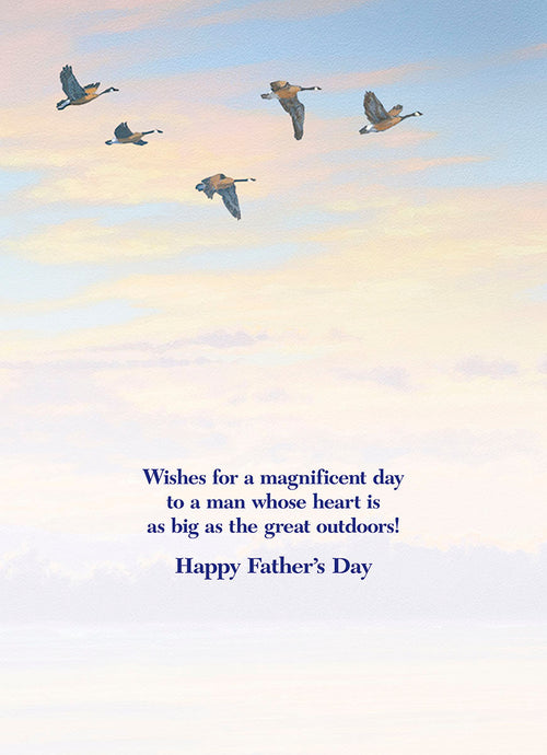 Inside of a Father's Day greeting card with flying geese against a blue sky, featuring the heartfelt message: 'Wishes for a magnificent day to a man whose heart is as big as the great outdoors! Happy Father's Day'.