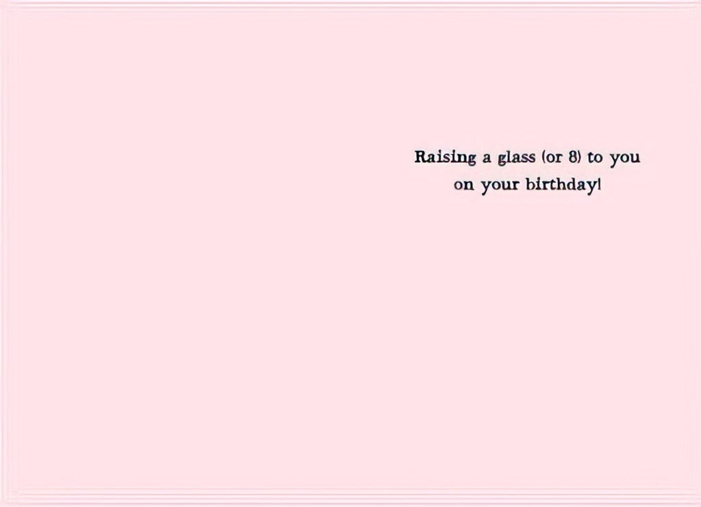 Inside view of a funny birthday greeting card for a friend, with pink background and text: 'Raising a glass (or 8) to you on your birthday!'