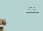 Inside view of a humorous birthday card with a small part of the grumpy cat visible, and text 'Your day. Your rules. HAPPY BIRTHDAY' on a light blue background, ready for personal messages.