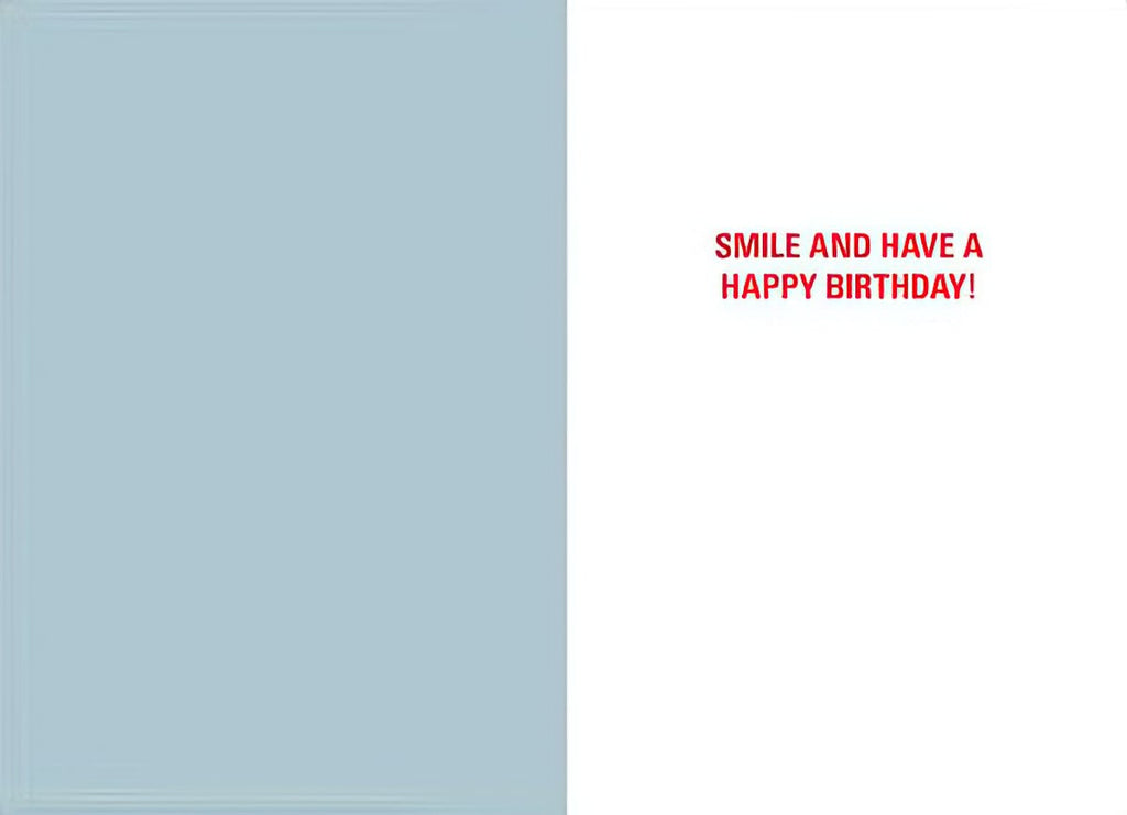 Inside of humorous greeting card with light blue left panel and white right panel featuring red text 'Smile and Have a Happy Birthday!'