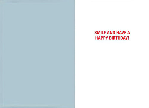 Inside of humorous greeting card with light blue left panel and white right panel featuring red text 'Smile and Have a Happy Birthday!'