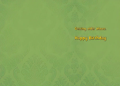 Inside of a funny greeting card with a simple green background and the printed text 'Getting older blows. Happy Birthday.'