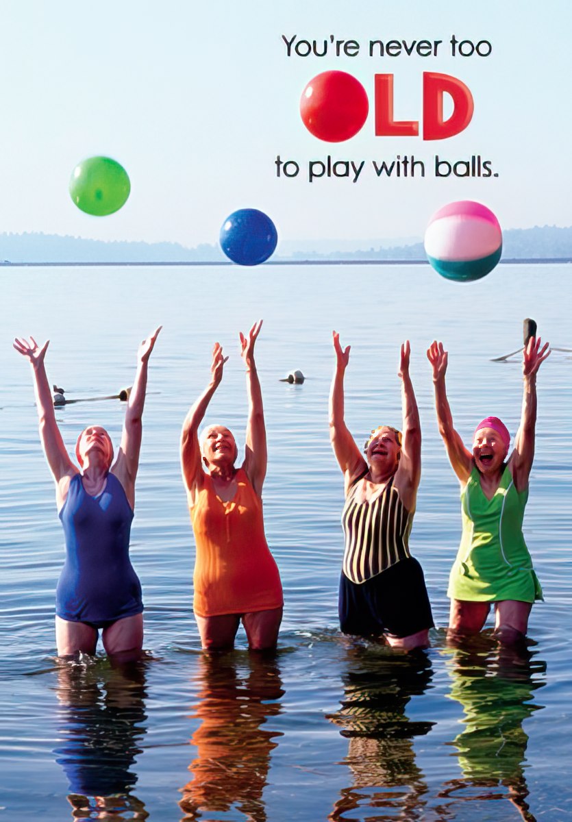 Funny birthday card for her, featuring four laughing senior women in swimsuits reaching for colorful beach balls in water, with the text 'You're never too OLD to play with balls.'