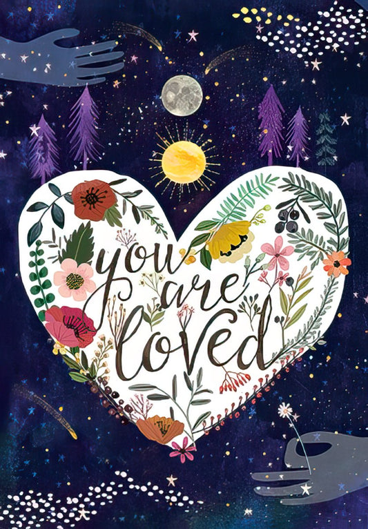 Front of a 'You Are Loved' friendship card with a floral heart, moon, sun, and starry night sky design.
