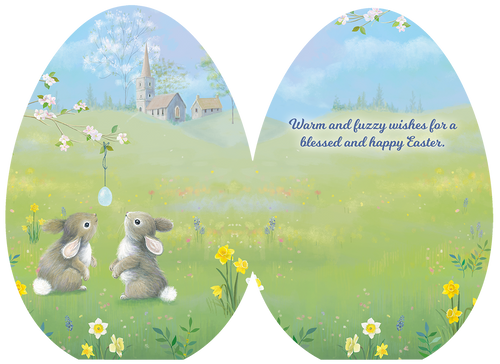 Inside view of a religious Easter greeting card for kids, showing the same charming spring meadow scene with two bunnies. On the right side, the card's message reads: 'Warm and fuzzy wishes for a blessed and happy Easter.' in a whimsical script.
