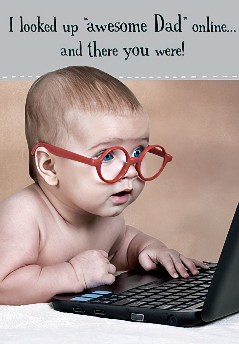 BABY WITH GLASSES LOOKING AT COMPUTER SCREEN
