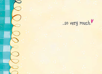 Inside of a card featuring a sunflower bucket, simple white with a festive birthday message in purple.