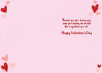 Inside of the romantic greeting card, featuring a soft pink background. Red script text conveys a heartfelt message: 'Thank you for being you and for loving me in all the ways that you do. Happy Valentine's Day'. Adorned with small red and pink hearts in the corners.