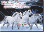 Box cover for 'Holiday Horses Christmas Card Assortment' by Leanin' Tree, showing three powerful white horses galloping through a snowy landscape.