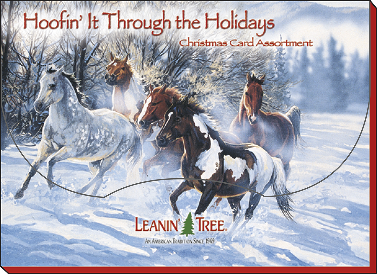 Box cover for 'Hoofin' It Through the Holidays' horse-themed card assortment, featuring several horses galloping through deep snow in a winter forest, with the Leanin' Tree logo visible.