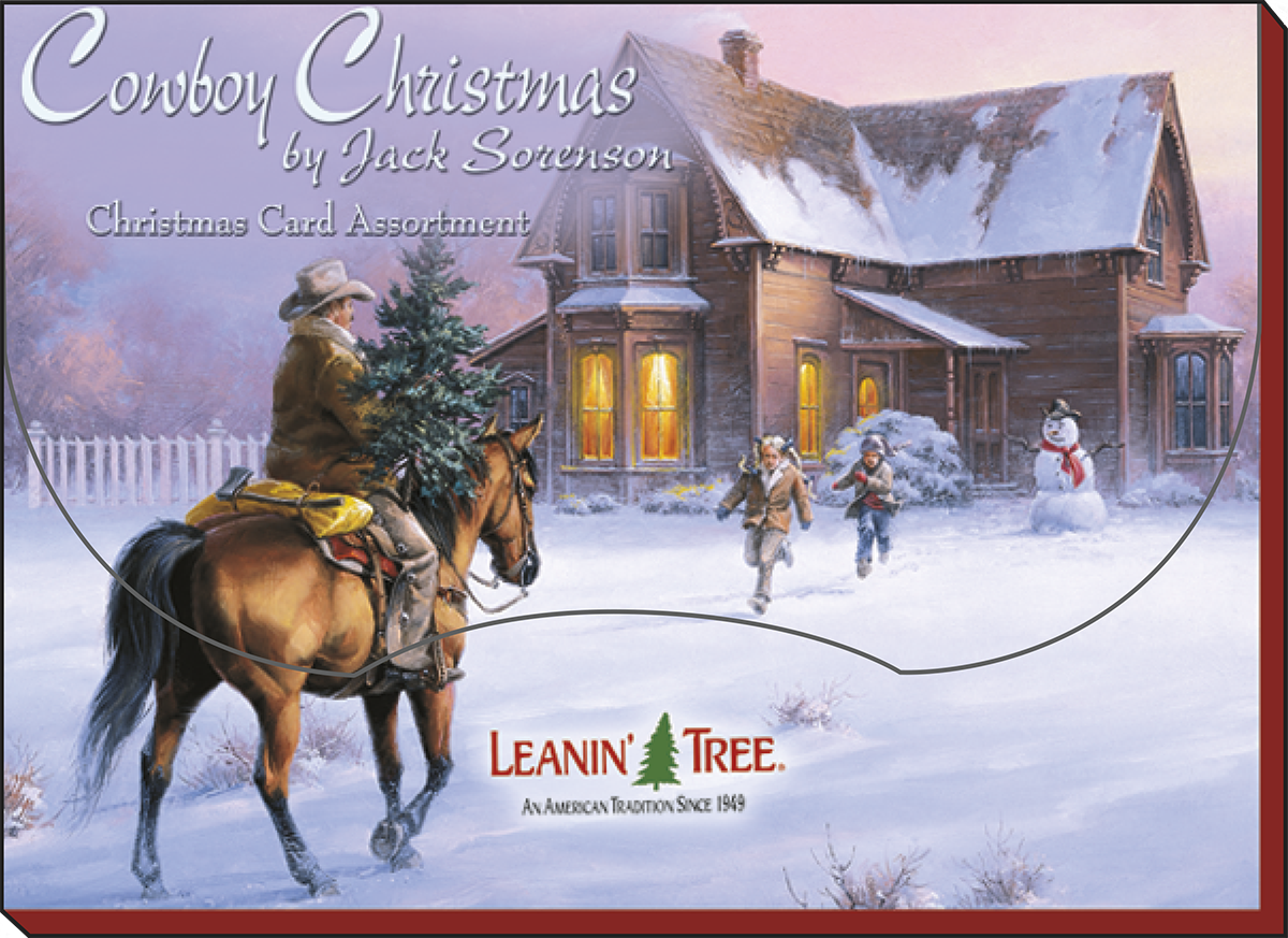 Western holiday greeting card box featuring a cowboy on horseback carrying a pine tree, children playing in snow, a snowman, and a rustic house, titled 'Cowboy Christmas by Jack Sorenson'.