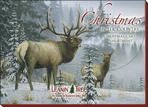 Front cover of the 'Christmas In Elk Country' card assortment box, depicting a majestic bull elk in a snowy evergreen forest, with other elk in the background.