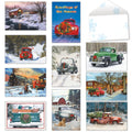 Assortment of festive holiday greeting cards featuring vintage trucks, a steam train, and snowy winter landscapes with a blank snowflake envelope.
