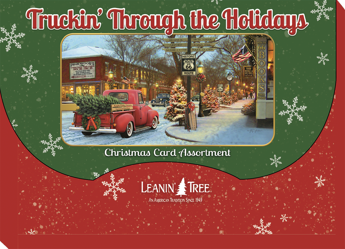 Front packaging for 'Truckin' Through the Holidays' Christmas card assortment, showing a red vintage truck with a Christmas tree in a decorated town square, surrounded by snowflakes.