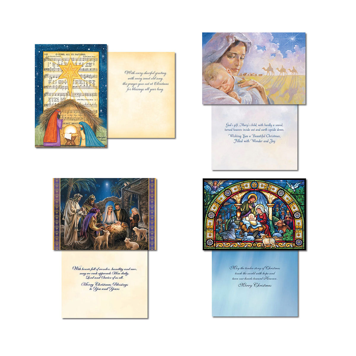 Multiple open religious greeting cards displaying various nativity scenes on the front and heartfelt Christian blessings and scripture inside, showcasing the diverse designs within the assortment.