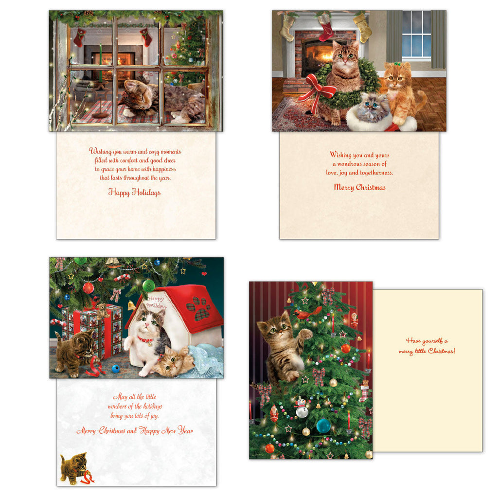 Four individual Christmas card designs (front and inside message visible) featuring charming kitten scenes including cats looking through a snowy window, by a fireplace with stockings, playing with presents, and climbing a decorated Christmas tree.