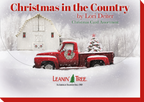 Close-up of 'Christmas in the Country' card assortment box cover, featuring a red vintage truck with a Christmas tree in front of a snow-covered white barn.