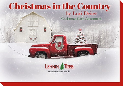 Close-up of 'Christmas in the Country' card assortment box cover, featuring a red vintage truck with a Christmas tree in front of a snow-covered white barn.