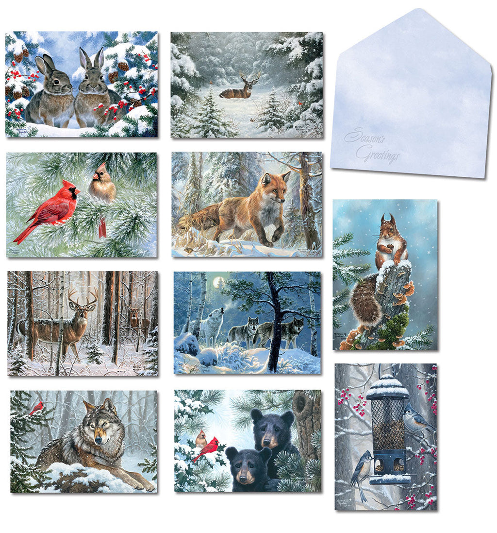 Assortment of ten Leanin' Tree Christmas greeting cards featuring various winter wildlife scenes like rabbits, deer, foxes, wolves, squirrels, cardinals, and bears in snowy landscapes, alongside a light blue 'Season's Greetings' envelope.