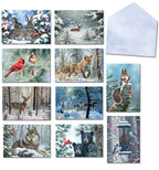Assortment of ten Leanin' Tree Christmas greeting cards featuring various winter wildlife scenes like rabbits, deer, foxes, wolves, squirrels, cardinals, and bears in snowy landscapes, alongside a light blue 'Season's Greetings' envelope.