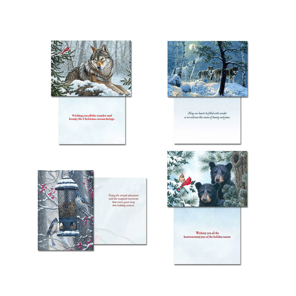 Four Leanin' Tree Christmas cards displayed open, each showing a different winter wildlife image on the front (wolf, wolves, birds at feeder, bears) and a heartfelt holiday message inside.