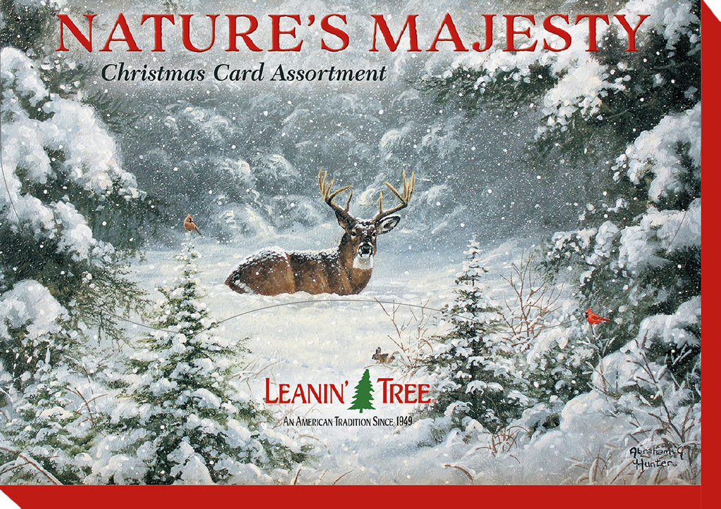 Box cover for 'Nature's Majesty Christmas Card Assortment' by Leanin' Tree, showing a majestic deer with antlers in a serene snowy forest during a snowfall.
