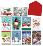 An overhead flat lay showing a variety of ten different festive gnome-themed holiday greeting cards and a single red envelope.