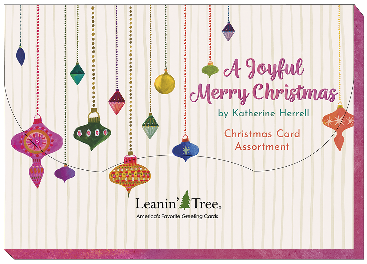 Leanin' Tree 'A Joyful Merry Christmas' card assortment cover, featuring colorful hanging ornaments on a striped background, designed by Katherine Herrell.